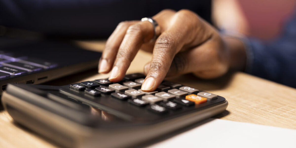 Black couple managing their self employed business finances and taxes