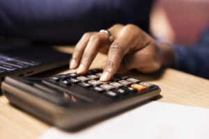 Black couple managing their self employed business finances and taxes